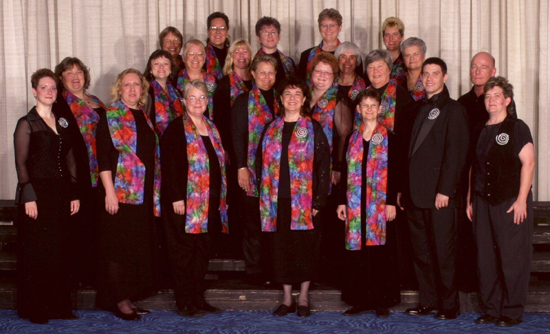 happy chorus in bright scarves with sparkly spiral pins