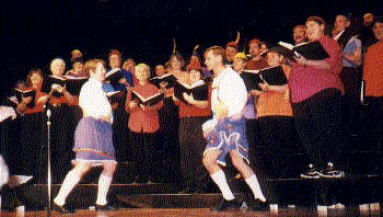 male and female dancers in skirts