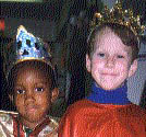 black girl and white boy in crowns