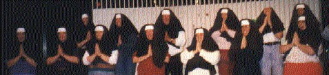 photo of singers in nuns' wimples