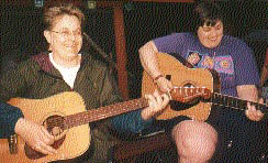 women playing guitars